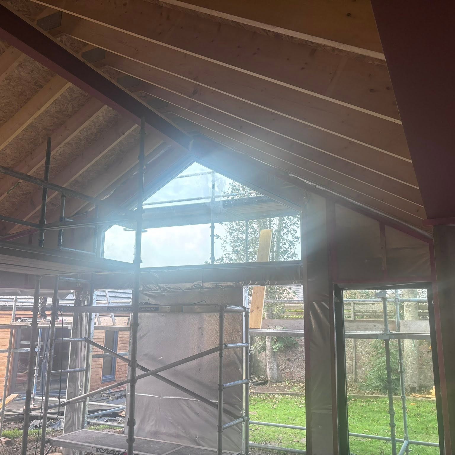 Vaulted timber roof structure inside an extension